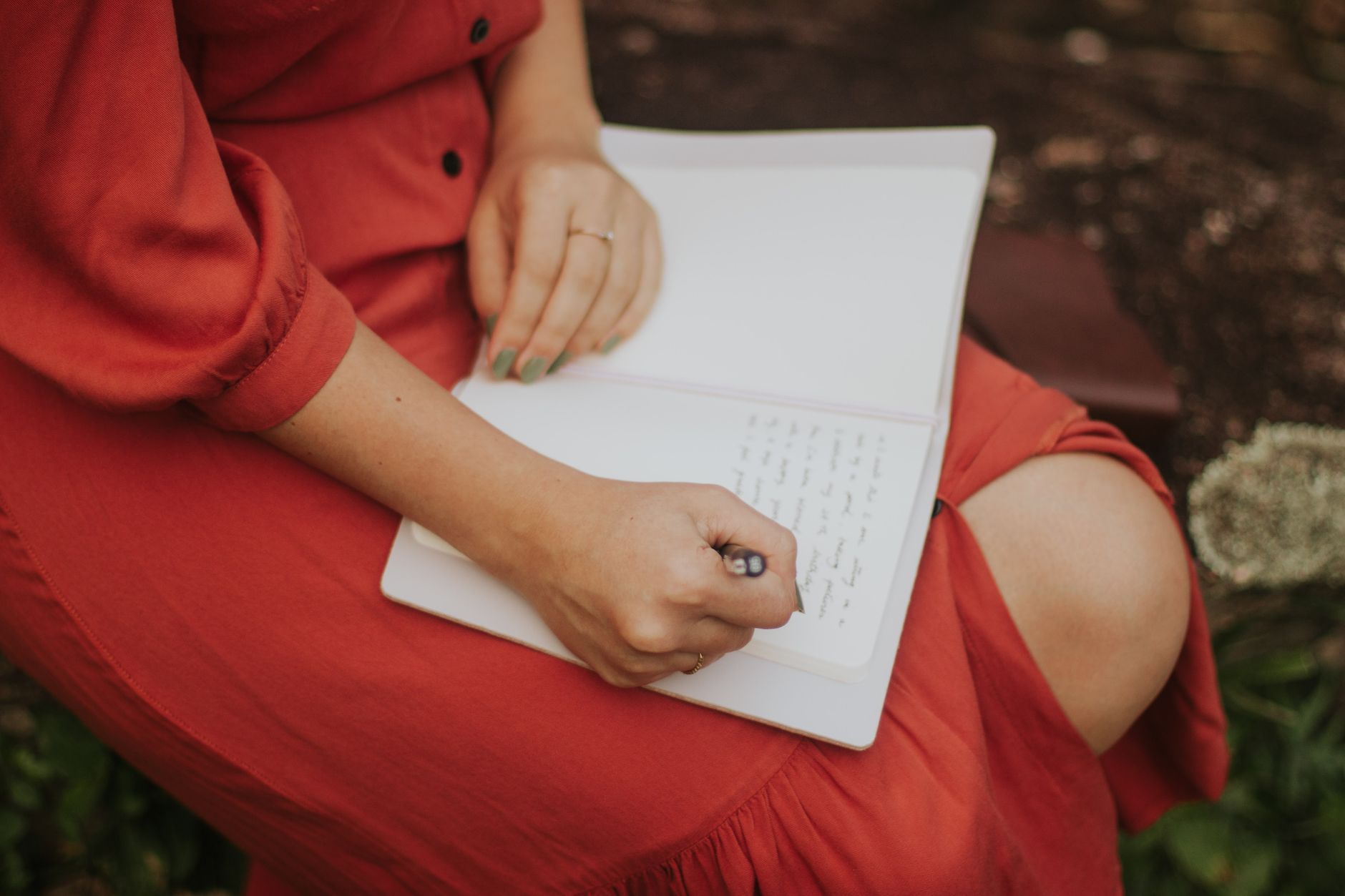 Travel writer taking notes in a library terrace
